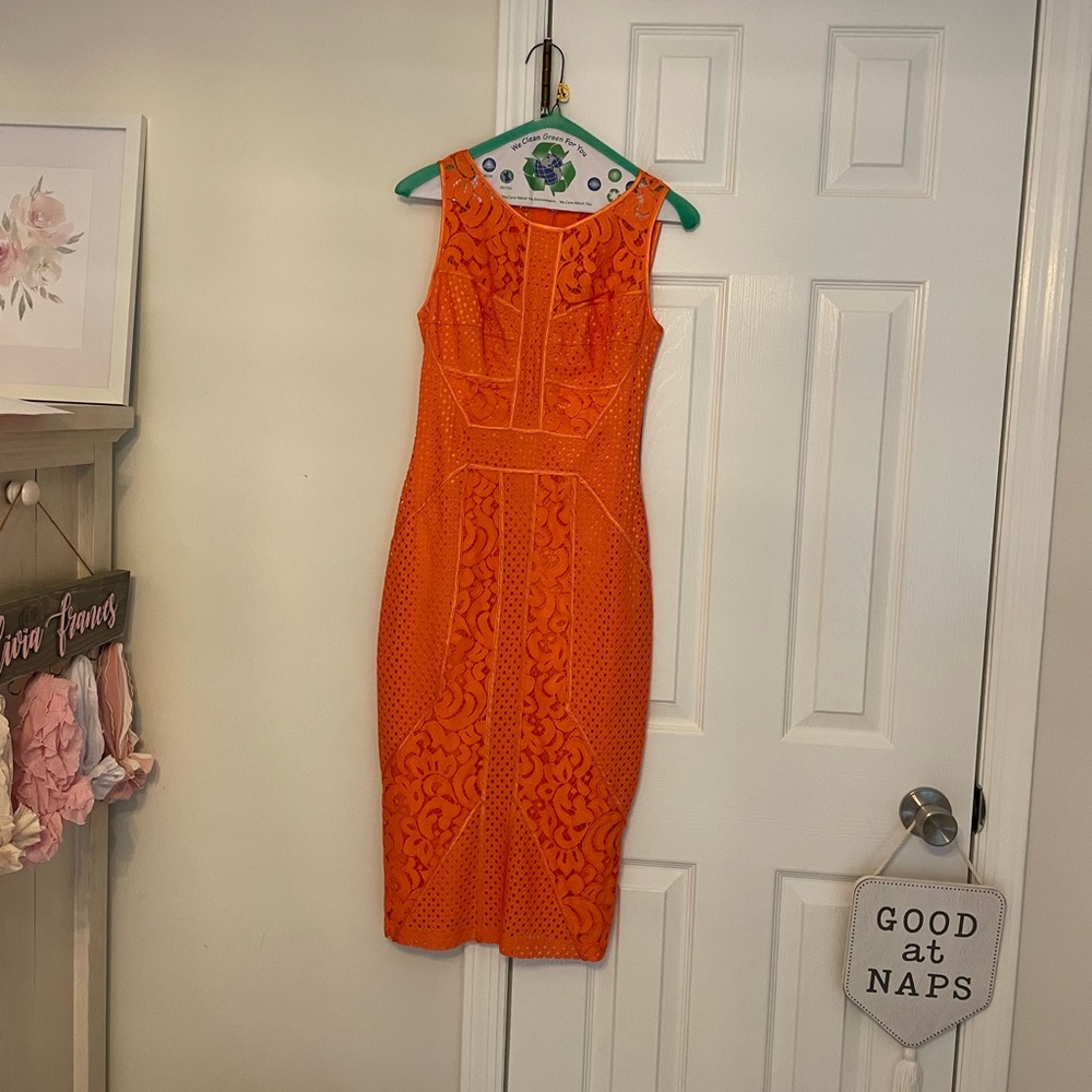 Bebe Orange Lace Dress. Size: 2 Worn one time & dry cleaned. No pulls or stains